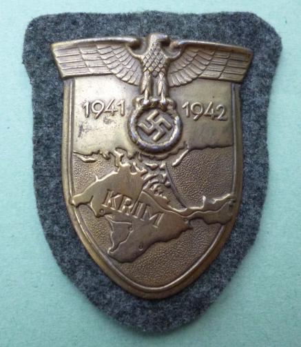 Third Reich : Crimea Battle Shield (Krimschild) 1941/42 on army field-grey cloth backing with metal back-plate.