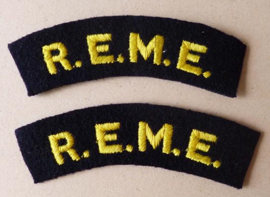 Pair of Royal Electrical & Mechanical Engineers 'R.E.M.E.' machine-embroidered cloth shoulder titles.