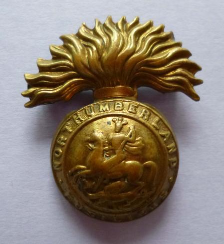 Northumberland Fusiliers 1916 economy all brass cap badge.