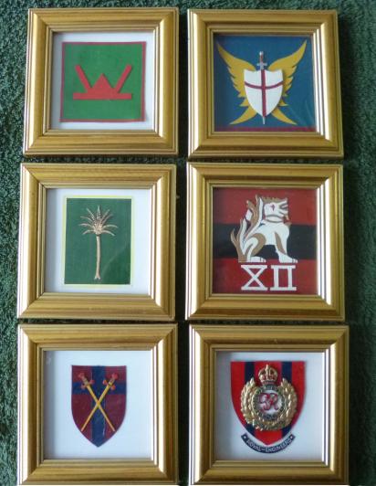 Set of six framed hand-made coloured unit / formation badges.