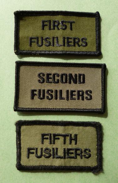 Royal Regiment of Fusiliers Shoulder-titles for the 1st, 2nd and 5th Battalions.