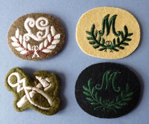 Four Army Trade/Qualification badges.