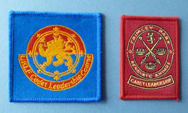 Two Army Cadet Force Leadership Course Qualification Badges.