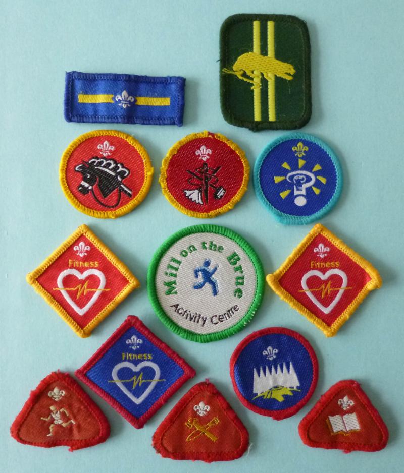 Collection of Thirteen Scout and Cub-Scout Cloth Badges.