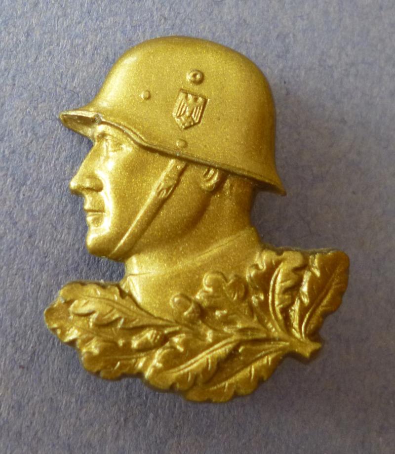 Third Reich : Tag der Wehrmacht Helmeted Soldier's Head in Gold Plastic.