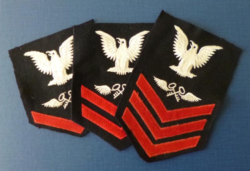 USA : Three US Navy Armbadges for Storekeeper Petty Officers 1st, 2nd and 3rd Class.