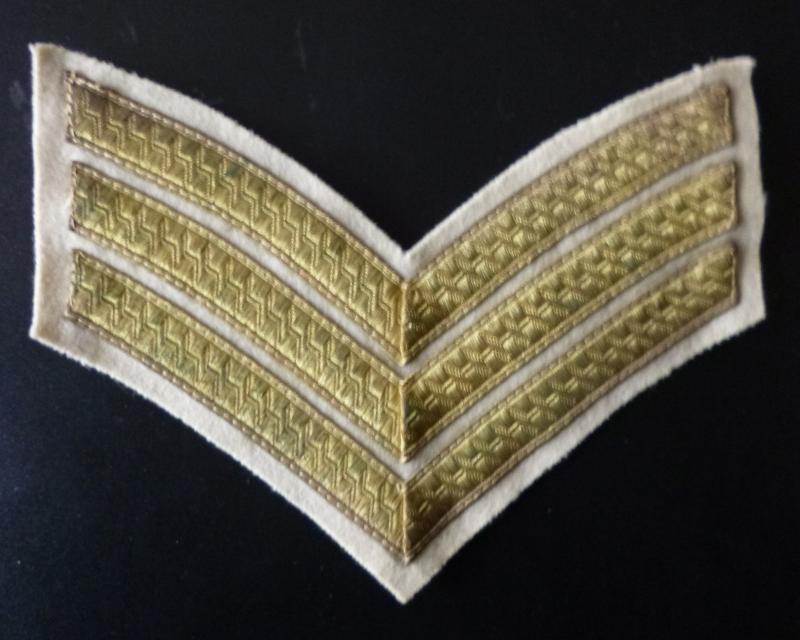 Army Sergeant's Mess-dress Chevrons in Gold Braid on White.