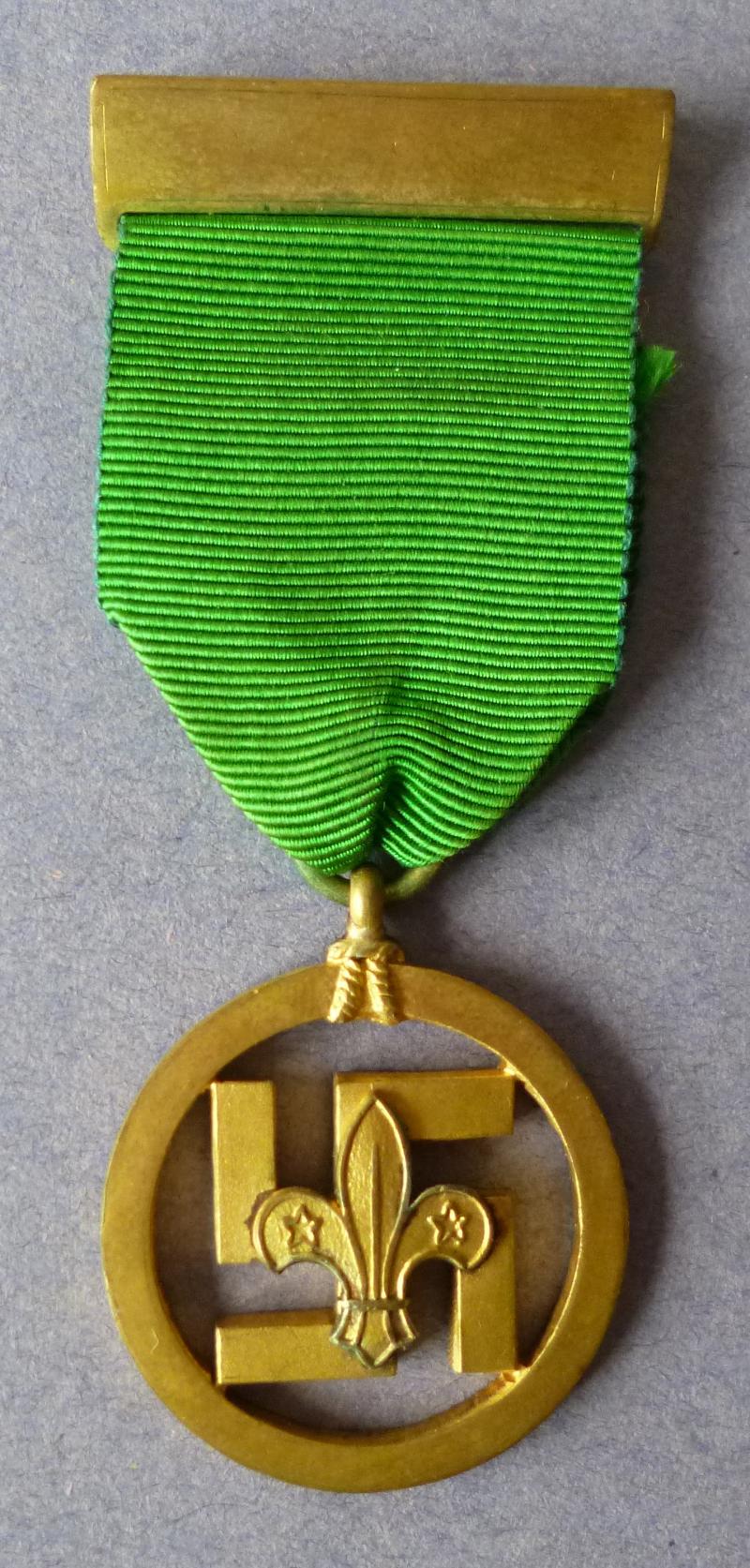 Boy Scouts Medal of Merit (1922 - 1934 pattern) Incorporating a Swastila awarded to W E Marsh  17.10.34.