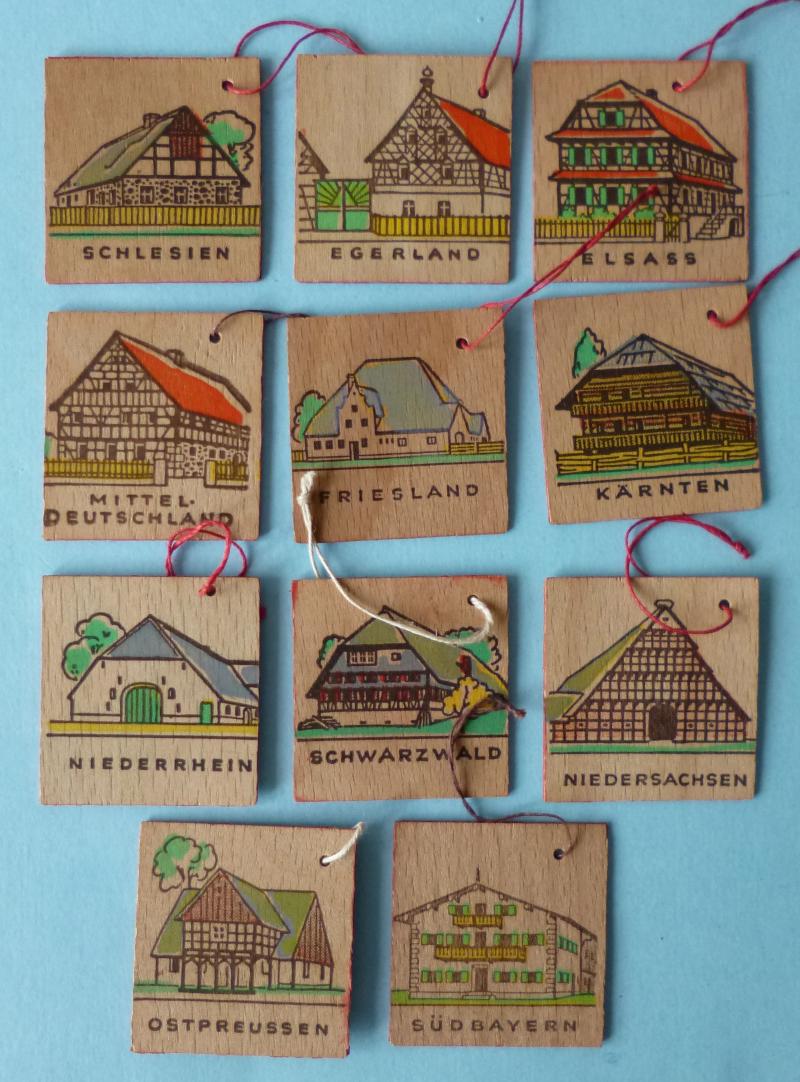 Third Reich : Collection of Eleven Winter Relief Work (WHW) Wooden Token-badges.