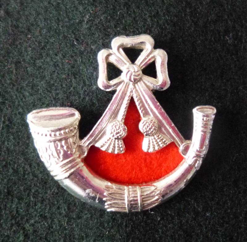 The Light Infantry Regimental cap-badge.