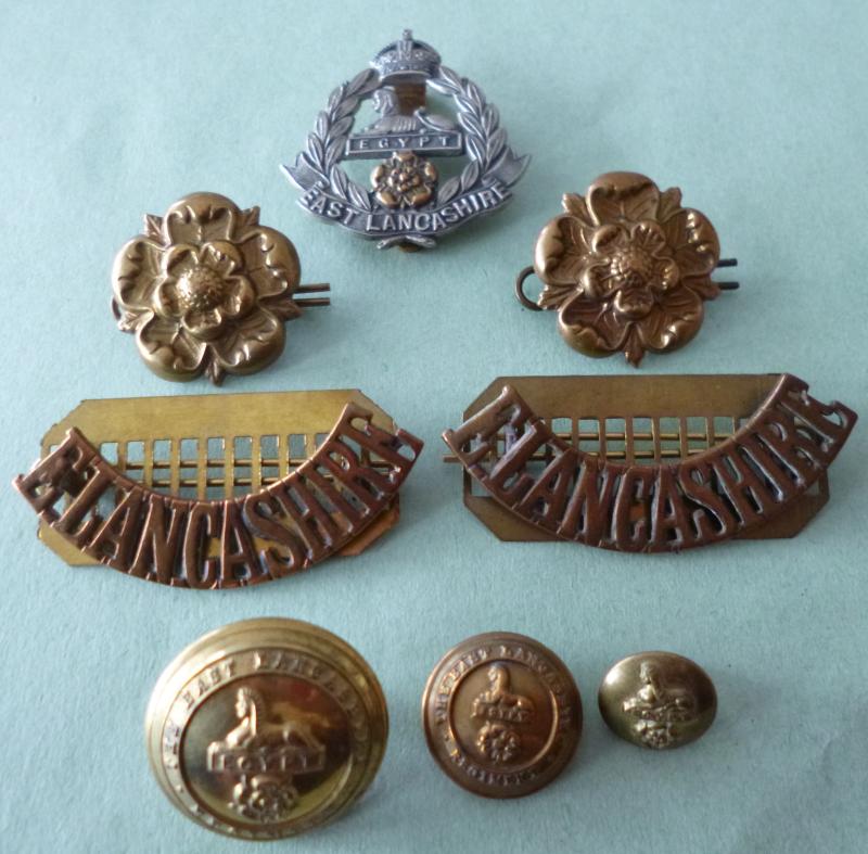 Set of East Lancashire Regiment (King's crown) Cap-badge, Collar-badges, Shoulder-titles and Buttons.