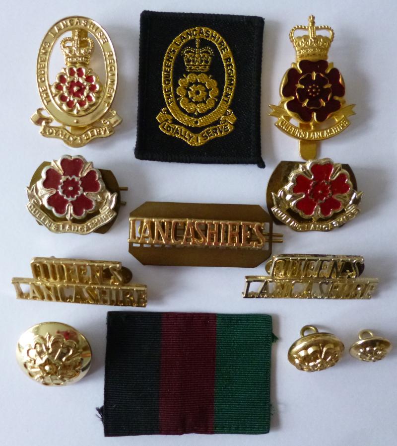 The Queen's Lancashire Regiment Grouping of Nine badges & Three Buttons.